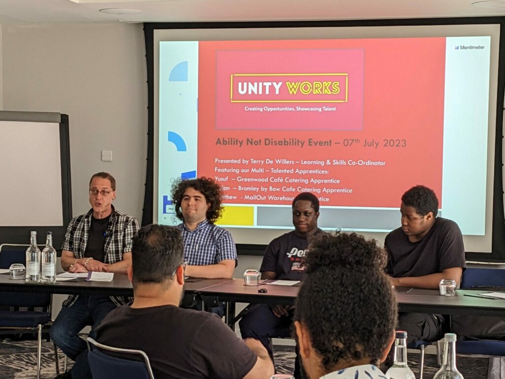 Photo of the panel from Unity Works sat at the front of the room taking questions about apprentices. 