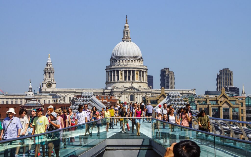 St Pauls on a suny day with Londoners and tourists going about their days
