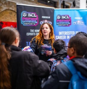 Decorative: business talking to students at one of our careers fairs