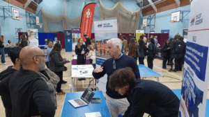 Selection of pictures from the event showing parents and studenst talking to buisiness and college representatives at stands, and taking part in workshops. 